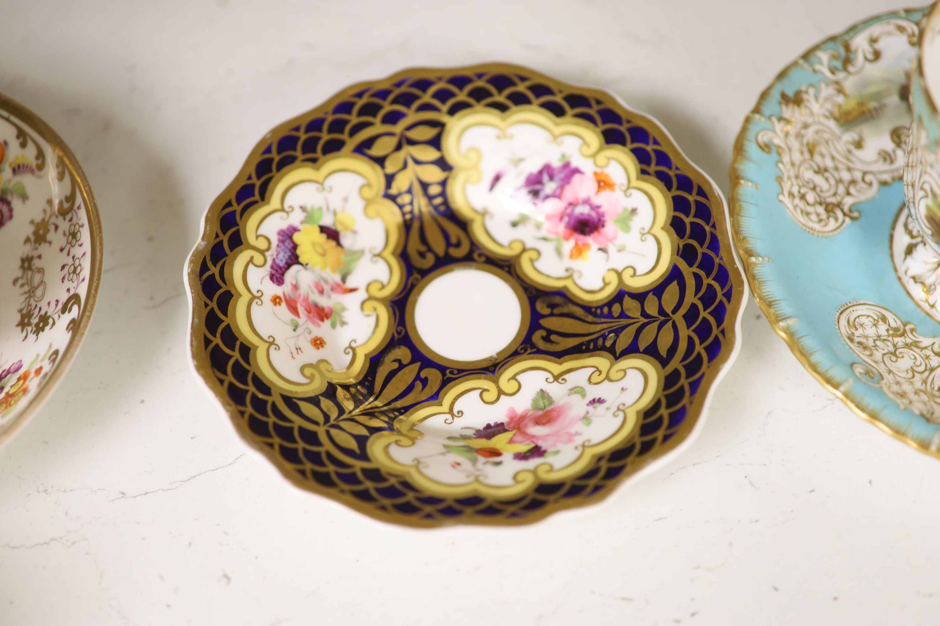 A Spode cup and saucer decorated with raised gilt birds and a basket with green leaves, marked Spode 3916, a Copeland and Garrett turqu